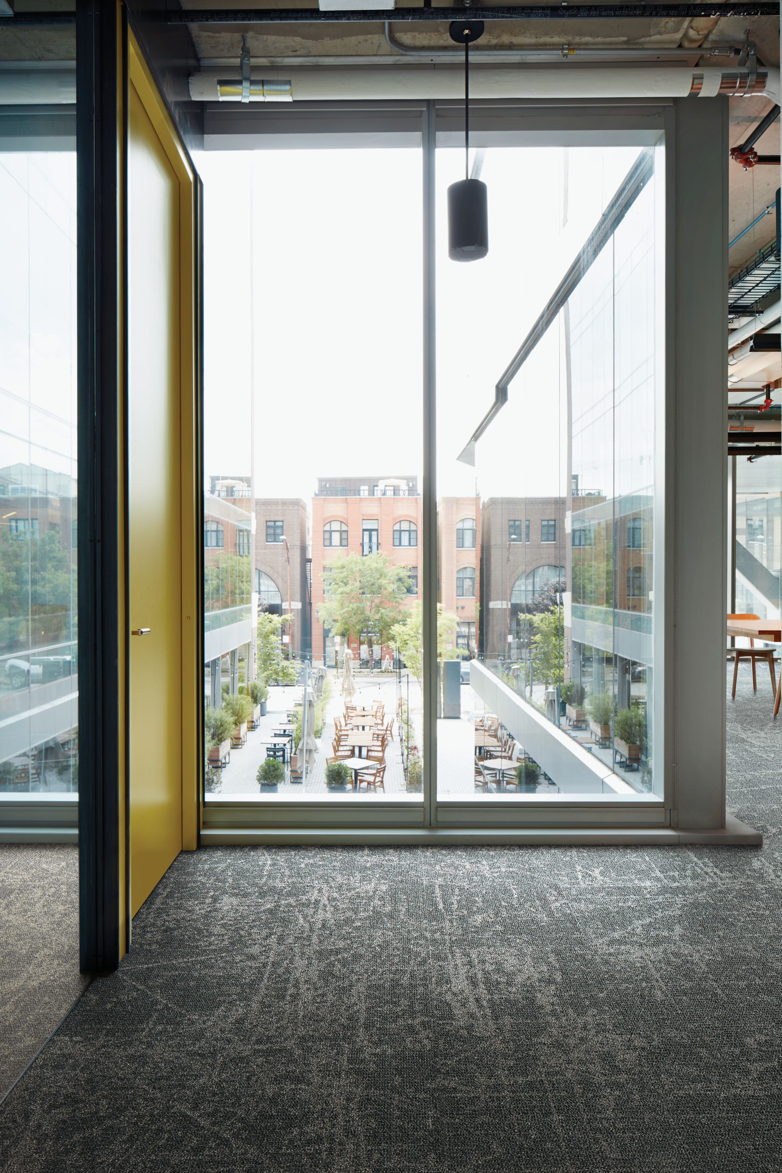 Interface Ice Breaker  carpet tile in room with glass windows showing outside seating area image number 3